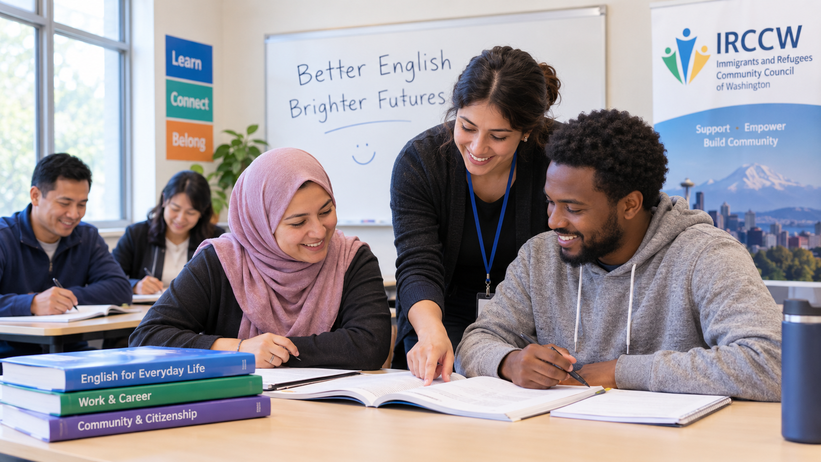 IRCCW instructor helps refugee and immigrant students during a free ESL class in Kent, WA, with books on everyday English, work skills, and citizenship on the table.